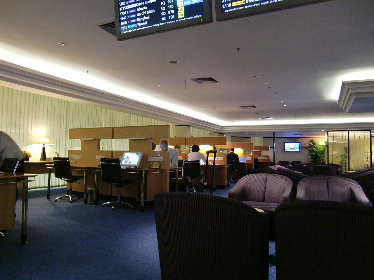 Seating and tables in an airport lounge.