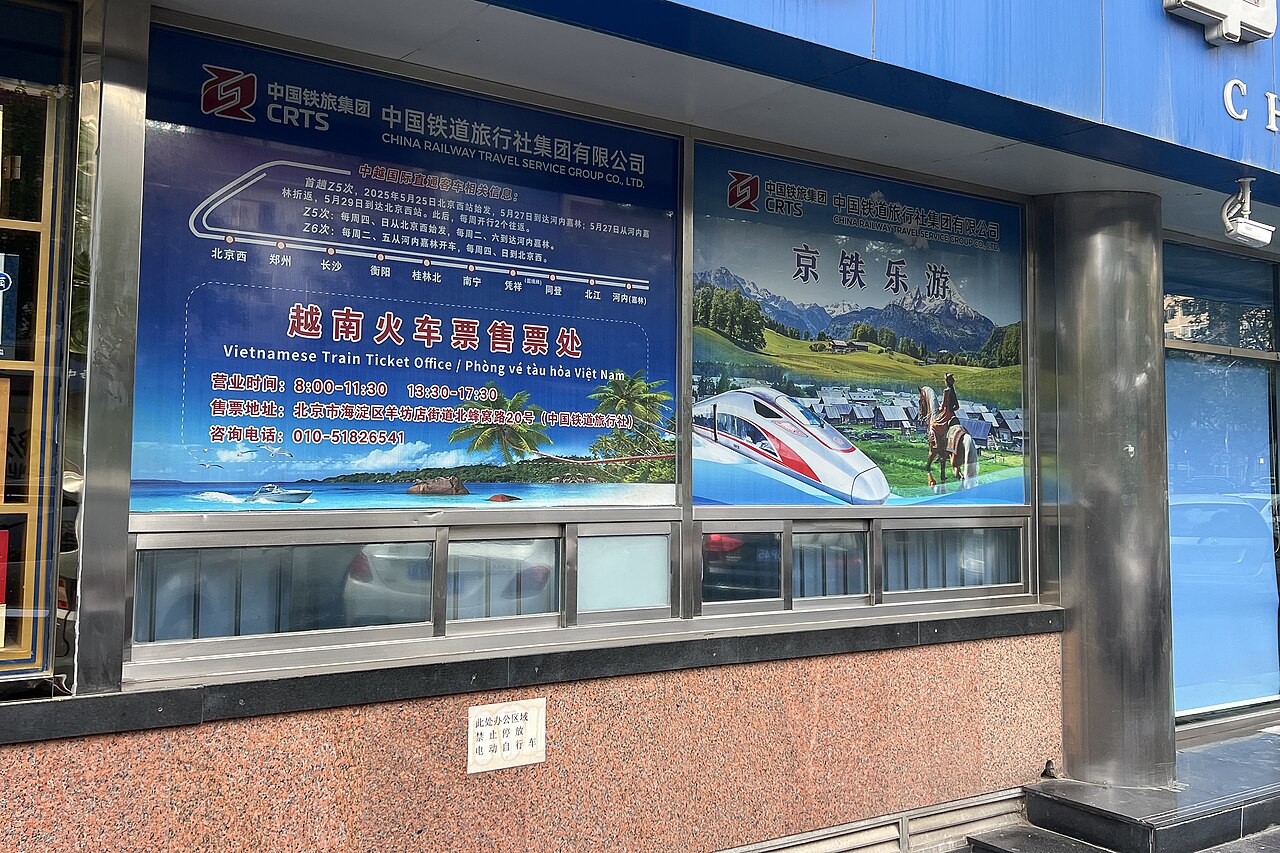 The street-facing window of an international rail ticket office.
