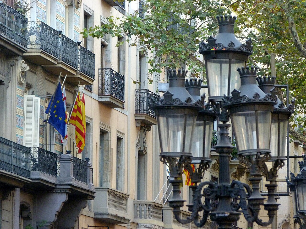 Ornate street lamps and historic façades in Barcelona.